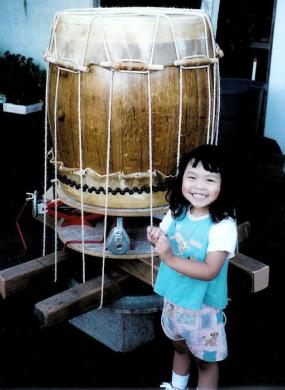 Young girl standing with a stretching rig